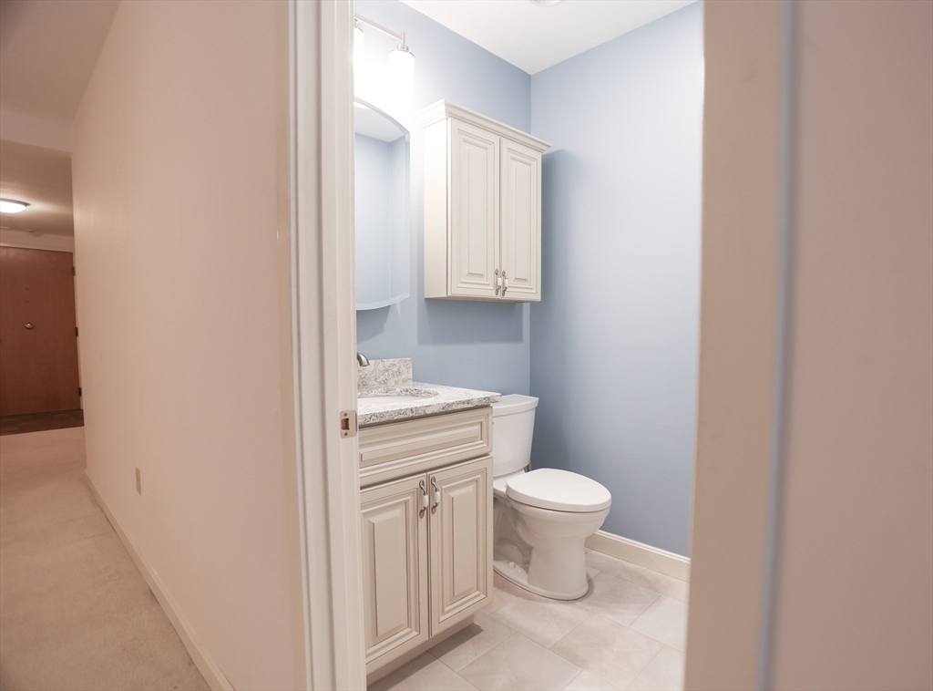 100 Keyes Road, Unit 220 Concord, MA 01742 - Photo 10 of 23 a bathroom with a toilet and a sink