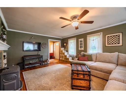 114 S Road Templeton, MA 01468 - Photo 19 of 42 a living room with furniture and a flat screen tv with wooden floor