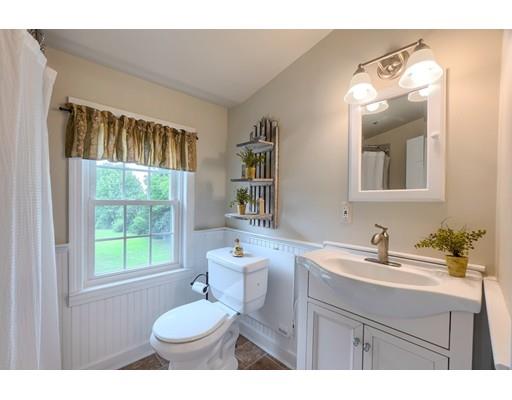 114 S Road Templeton, MA 01468 - Photo 32 of 42 a bathroom with a sink a toilet and a mirror