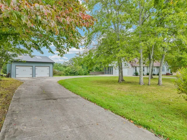 a house with a yard and garage