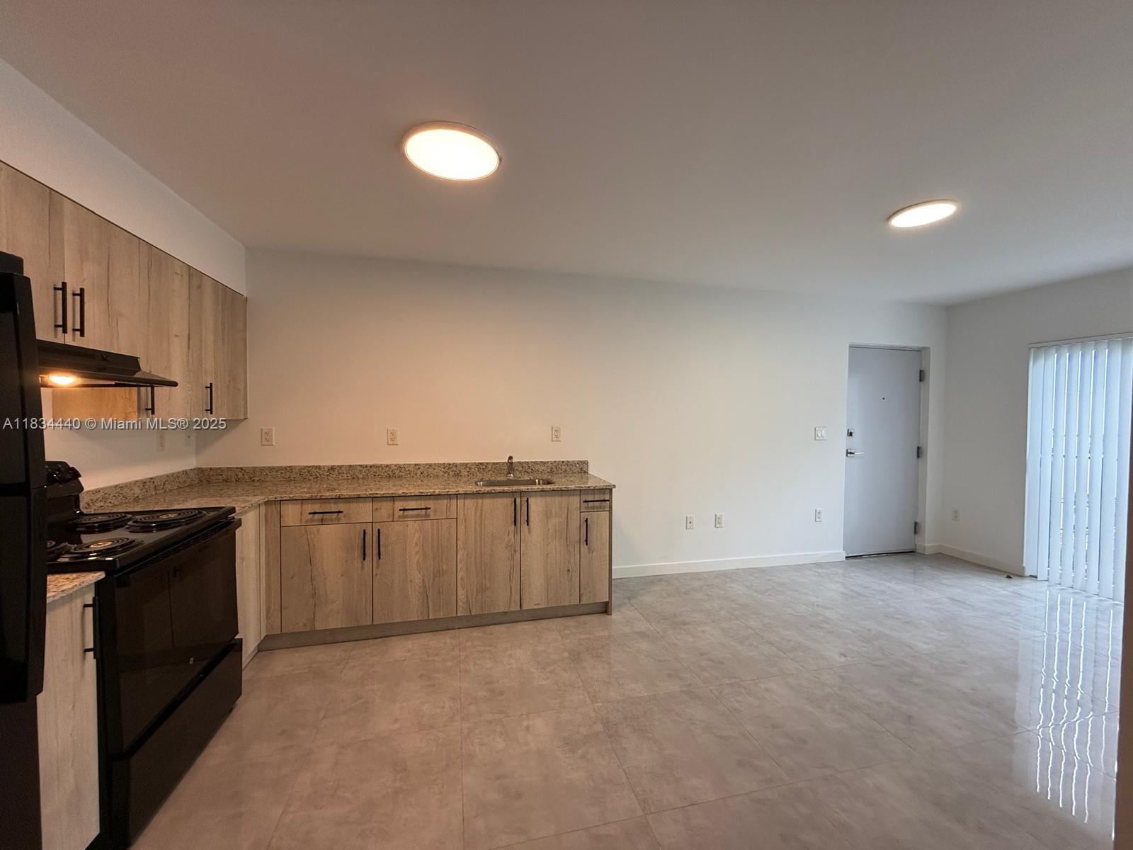 Golden Glades Miami, FL 33161 - Photo 4 of 11 a view of a kitchen with a sink