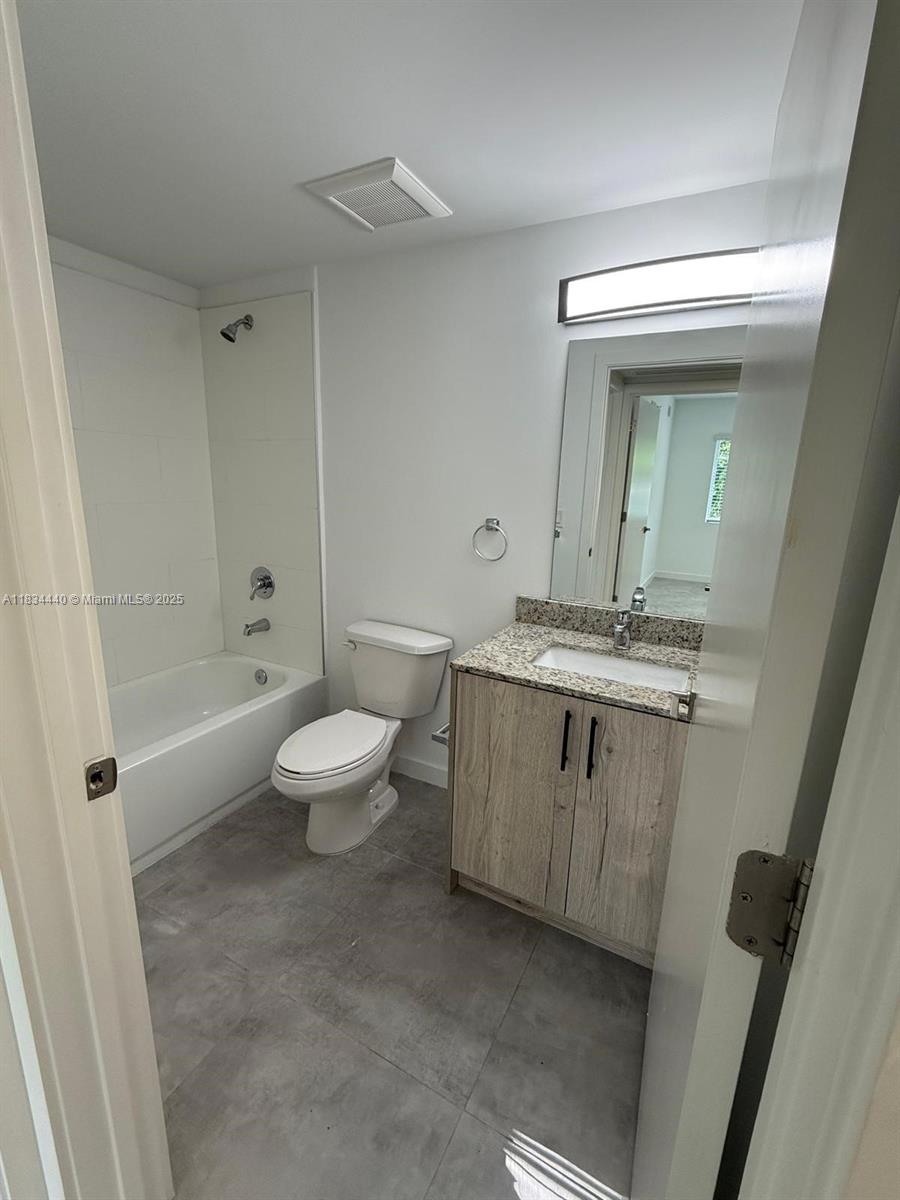Golden Glades Miami, FL 33161 - Photo 9 of 11 a bathroom with a sink a toilet and shower