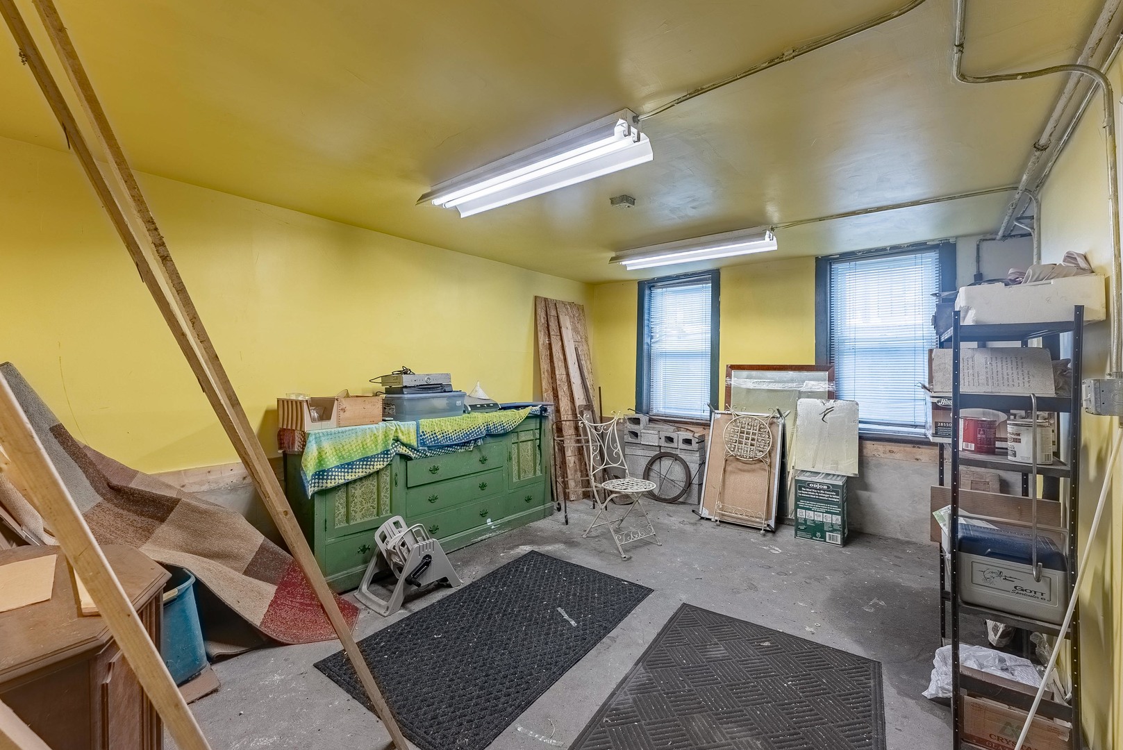 1019 West 18th Street Chicago, IL 60608 - Photo 19 of 26 a room with lots of wooden furniture and a window