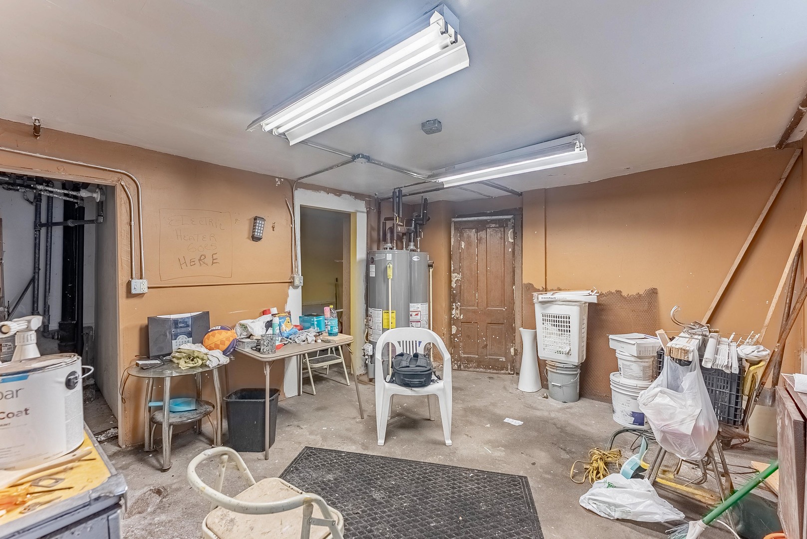 1019 West 18th Street Chicago, IL 60608 - Photo 24 of 26 a room with furniture a rug and a chandelier