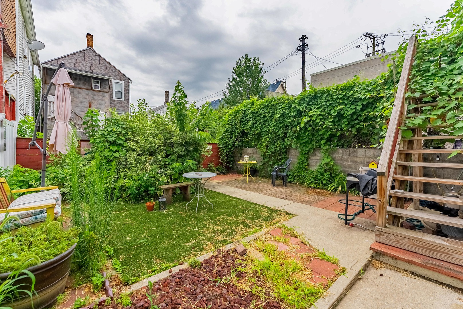 1019 West 18th Street Chicago, IL 60608 - Photo 25 of 26 a view of a house with backyard and garden