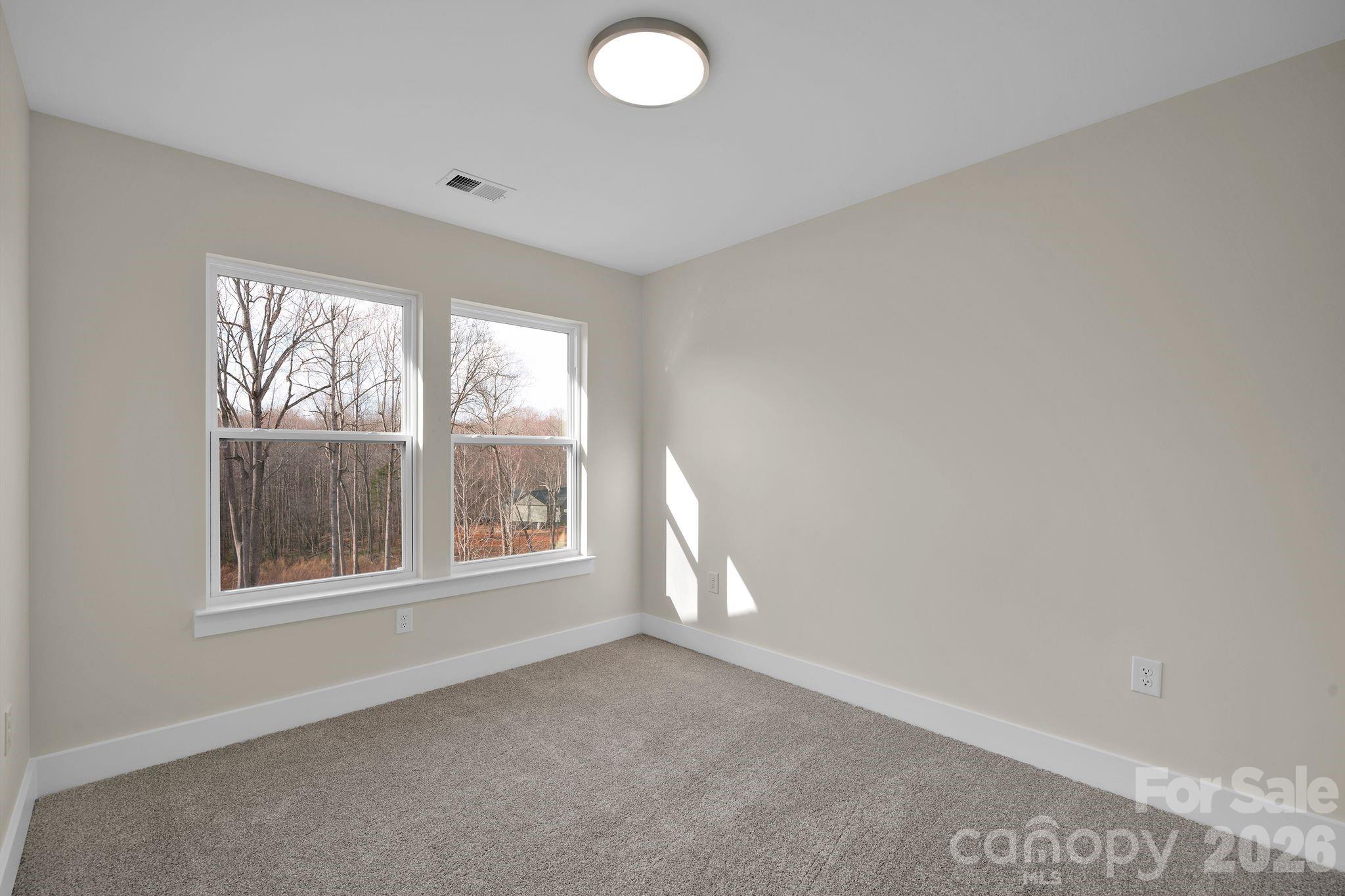 9052 Unity Church Road Mooresville, NC 28115 - Photo 22 of 32 an empty room with windows