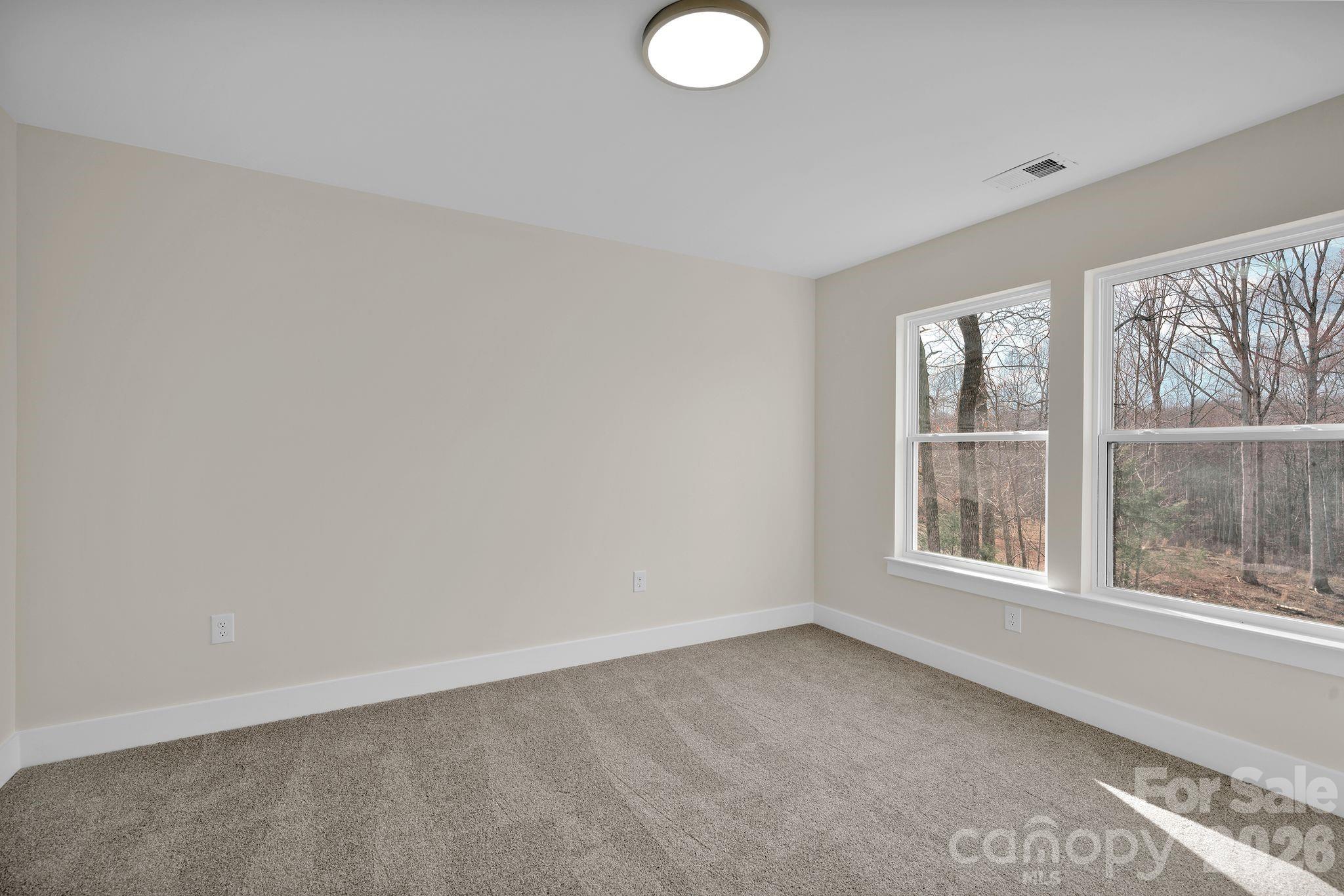 9052 Unity Church Road Mooresville, NC 28115 - Photo 31 of 32 an empty room with a window