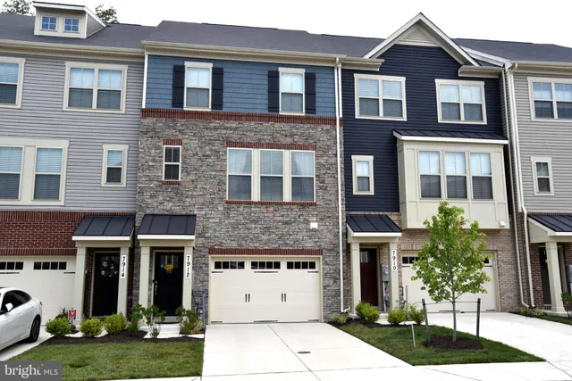 a view of houses with a street