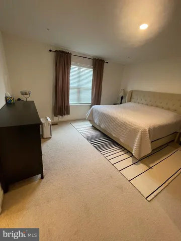 a view of a hallway with hallway to closet