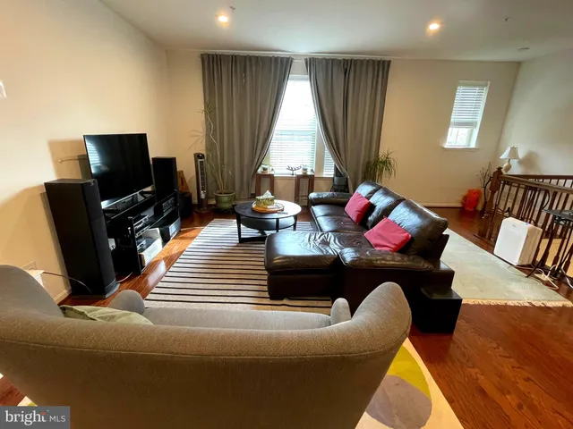 a living room with couch and a flat screen tv