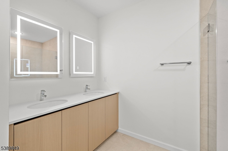 70 Ridgedale Avenue, Unit 207 Morristown, NJ 07960 - Photo 12 of 21 a bathroom with a sink and a mirror