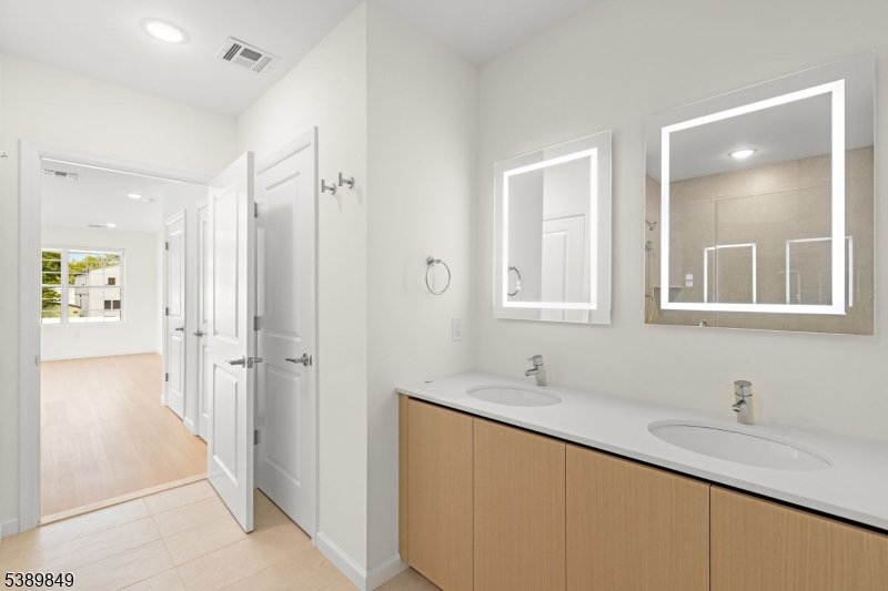 70 Ridgedale Avenue, Unit 207 Morristown, NJ 07960 - Photo 14 of 21 a bathroom with a sink and a mirror