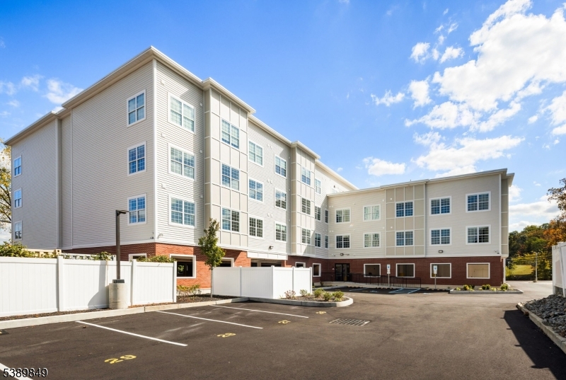 70 Ridgedale Avenue, Unit 207 Morristown, NJ 07960 - Photo 20 of 21 a front view of a building with street view and trees