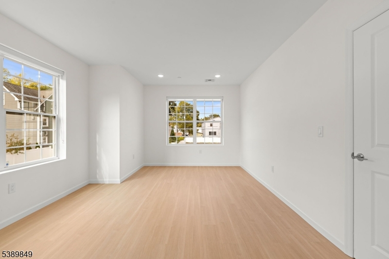 70 Ridgedale Avenue, Unit 207 Morristown, NJ 07960 - Photo 2 of 21 an empty room with windows