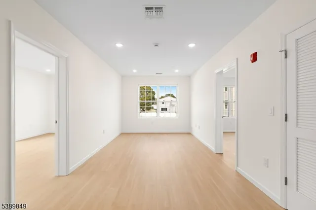 a very nice looking hallway with a white walls