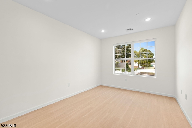 70 Ridgedale Avenue, Unit 207 Morristown, NJ 07960 - Photo 9 of 21 an empty room with windows