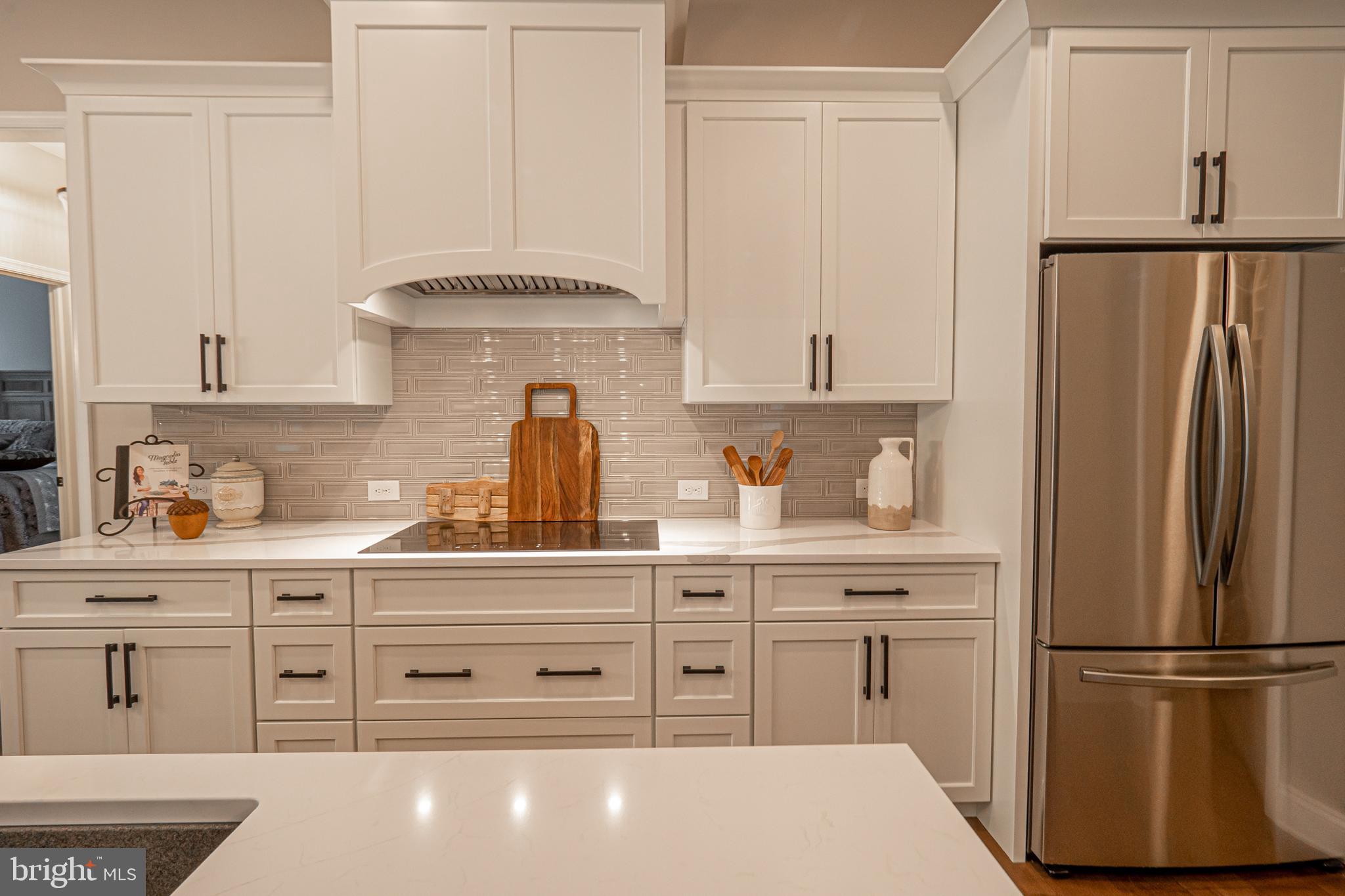 8 Timber Mill Lane, Unit TAGLIO Landenberg, PA 19350 - Photo 8 of 42 a kitchen with stainless steel appliances a refrigerator sink and cabinets
