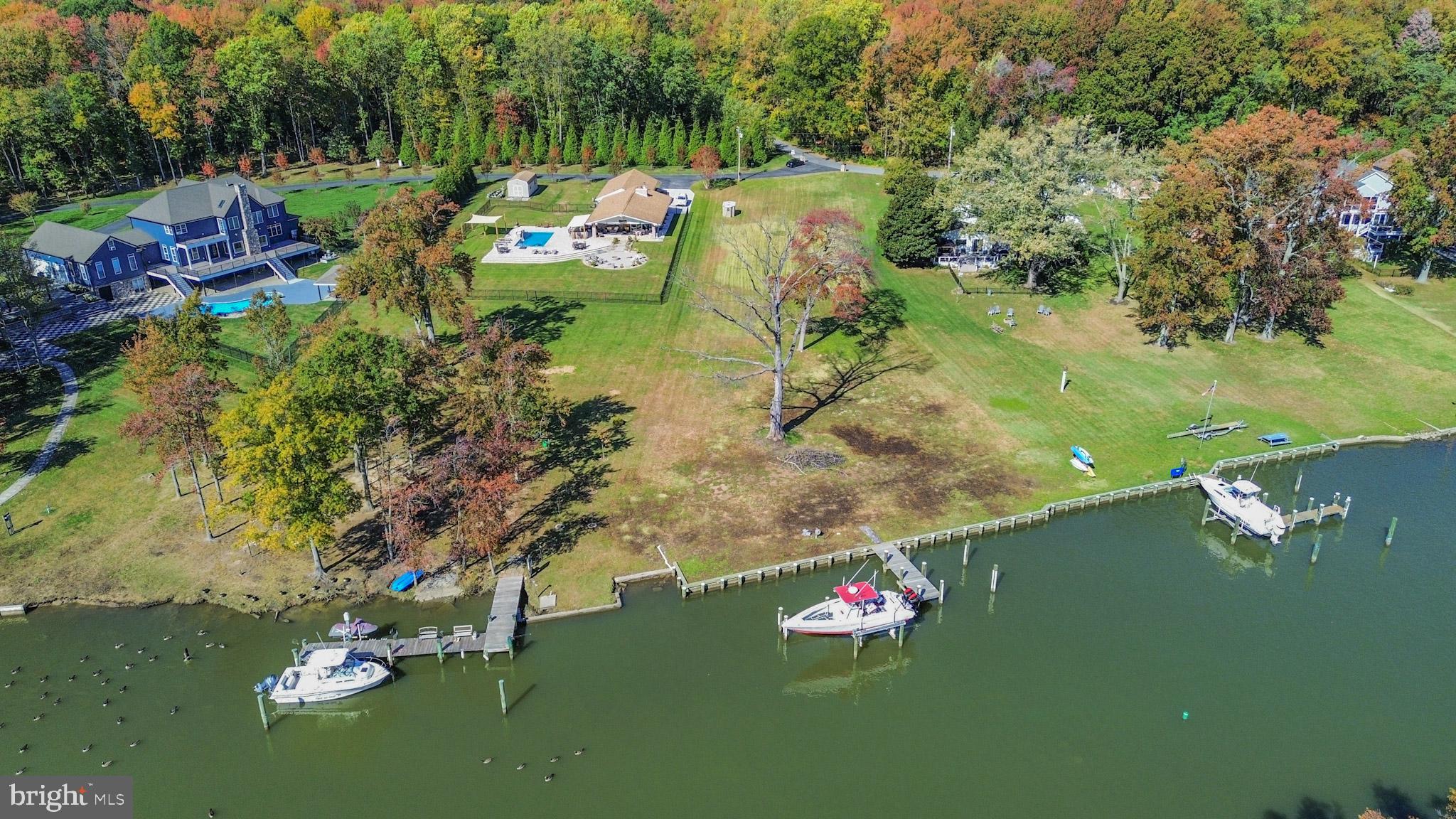 1321 South Seneca Road Middle River, MD 21220 - Photo 27 of 50 a backyard of a house with a yard and lake view