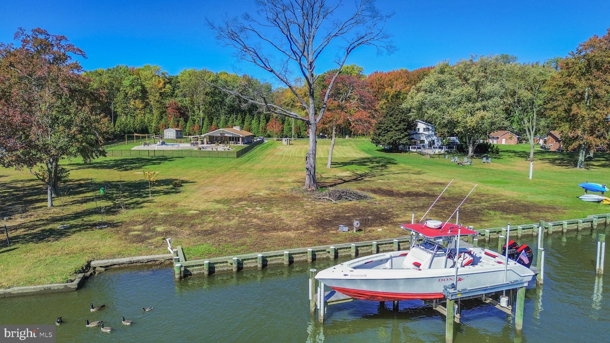 1321 South Seneca Road Middle River, MD 21220 - Photo 29 of 50 a view of a lake with a table and chairs
