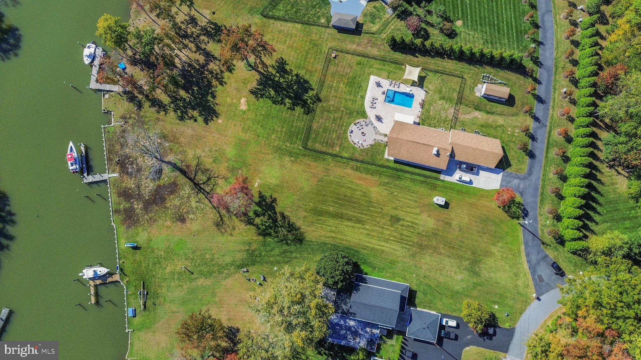 1321 South Seneca Road Middle River, MD 21220 - Photo 34 of 50 an aerial view of a house with a yard swimming pool and outdoor seating