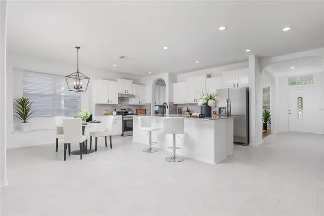 a view of a kitchen and dining room