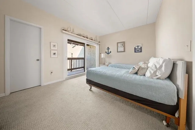 a bathroom with a sink toilet vanity and shower