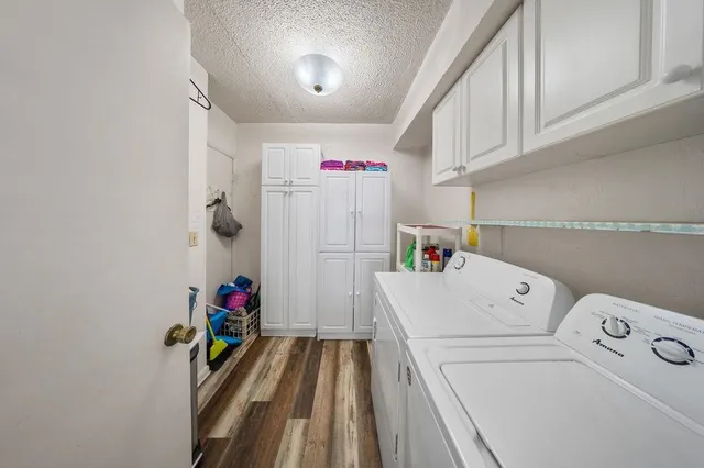 a front view of a house with barbeque grill and outdoor seating