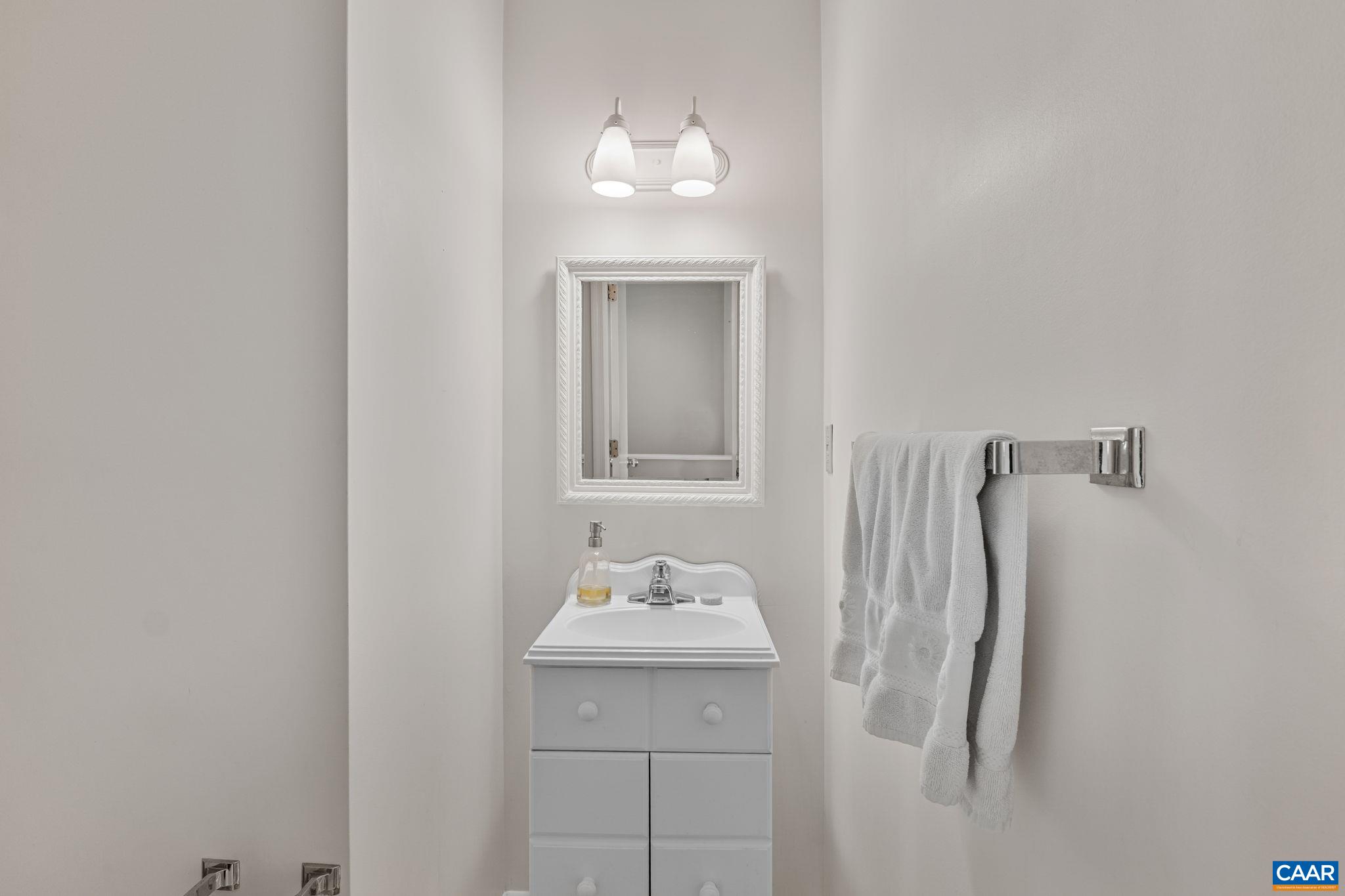 1212 Chatham Ridge Charlottesville, VA 22901 - Photo 12 of 17 a bathroom with a sink vanity and a mirror