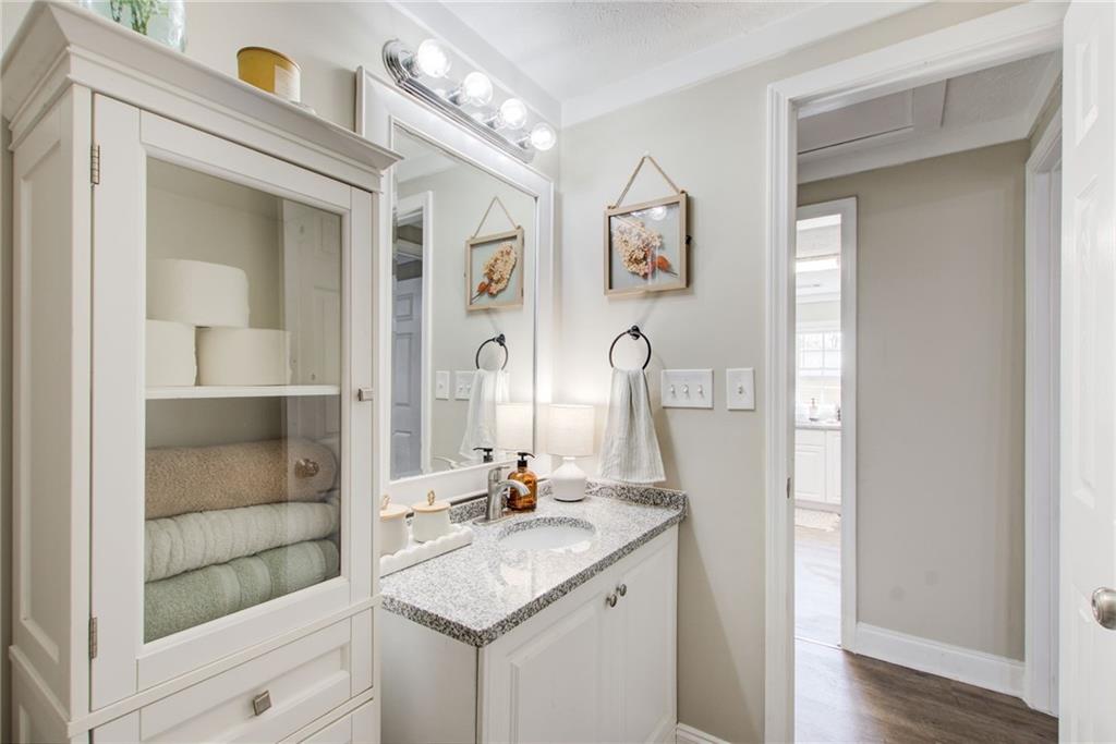 411 Ash Street Monroe, GA 30655 - Photo 20 of 36 a bathroom with a sink and a mirror