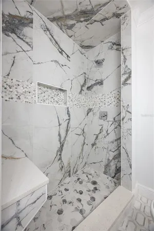 a spacious bathroom with a double vanity sink a mirror and a bathtub