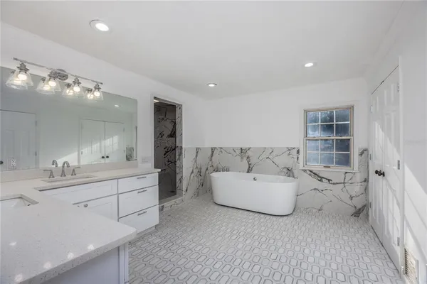 a view of entryway and hall with a workspace