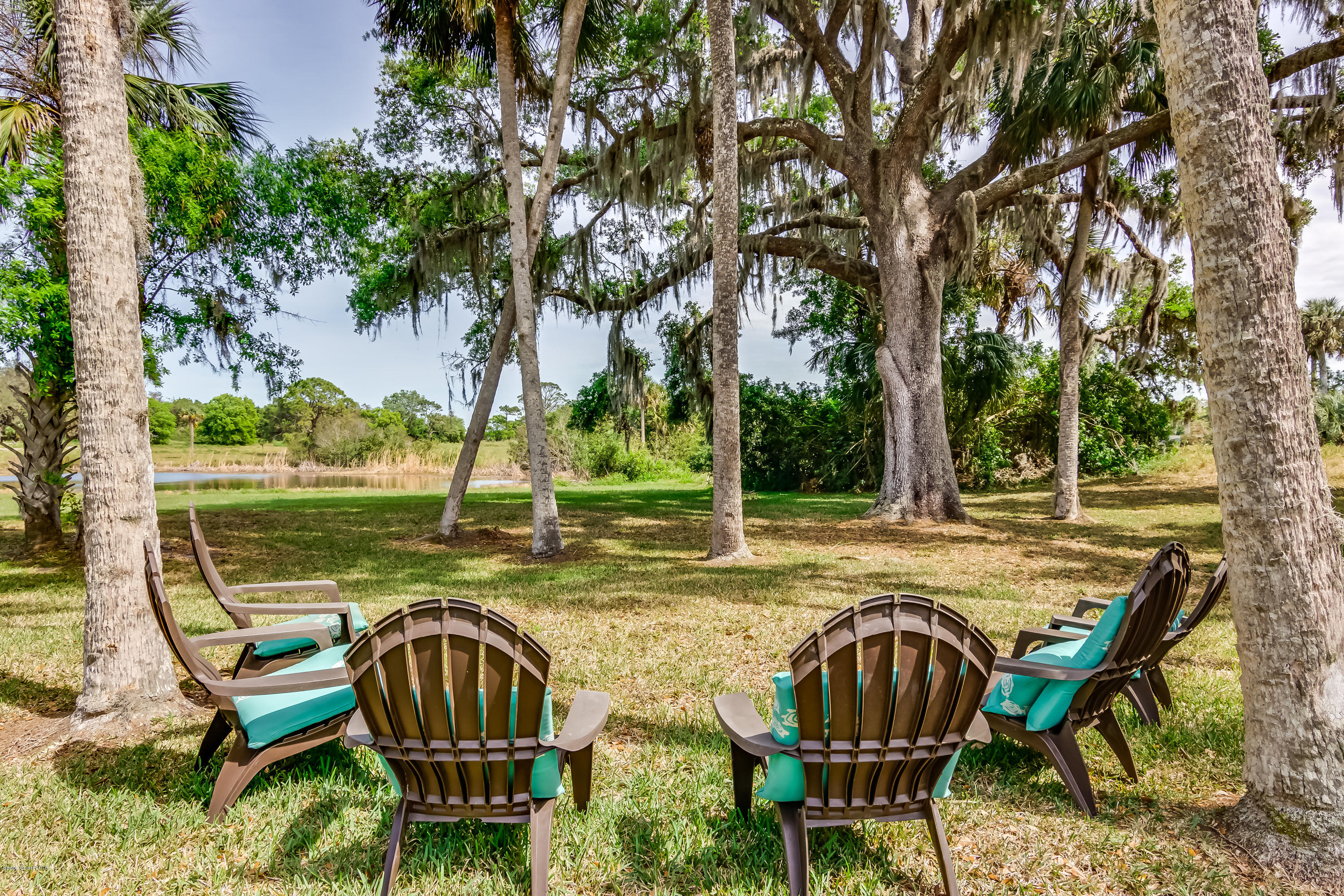 777 Seymour Road Northeast Palm Bay, FL 32905 - Photo 22 of 25 Backyard Sitting Area