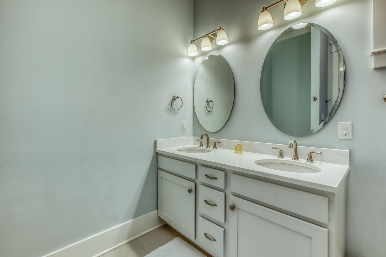 105 Lifeguard Loop West Inlet Beach, FL 32461 - Photo 19 of 45 a bathroom with a double vanity sink and a mirror