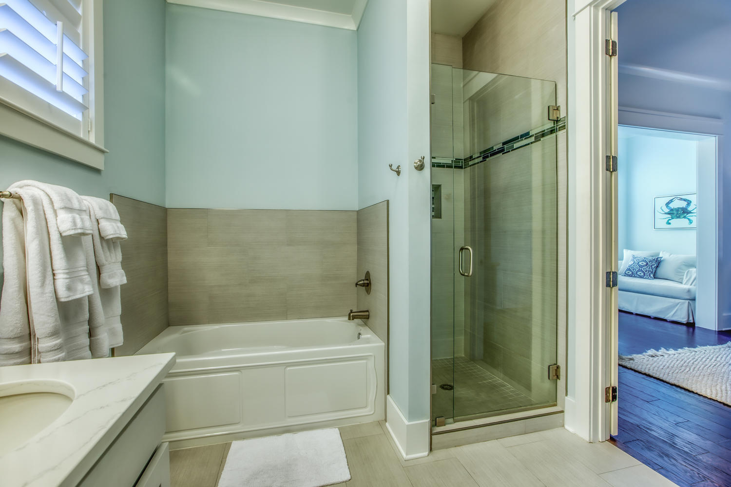 105 Lifeguard Loop West Inlet Beach, FL 32461 - Photo 20 of 45 a bathroom with a granite countertop bathtub shower and vanity