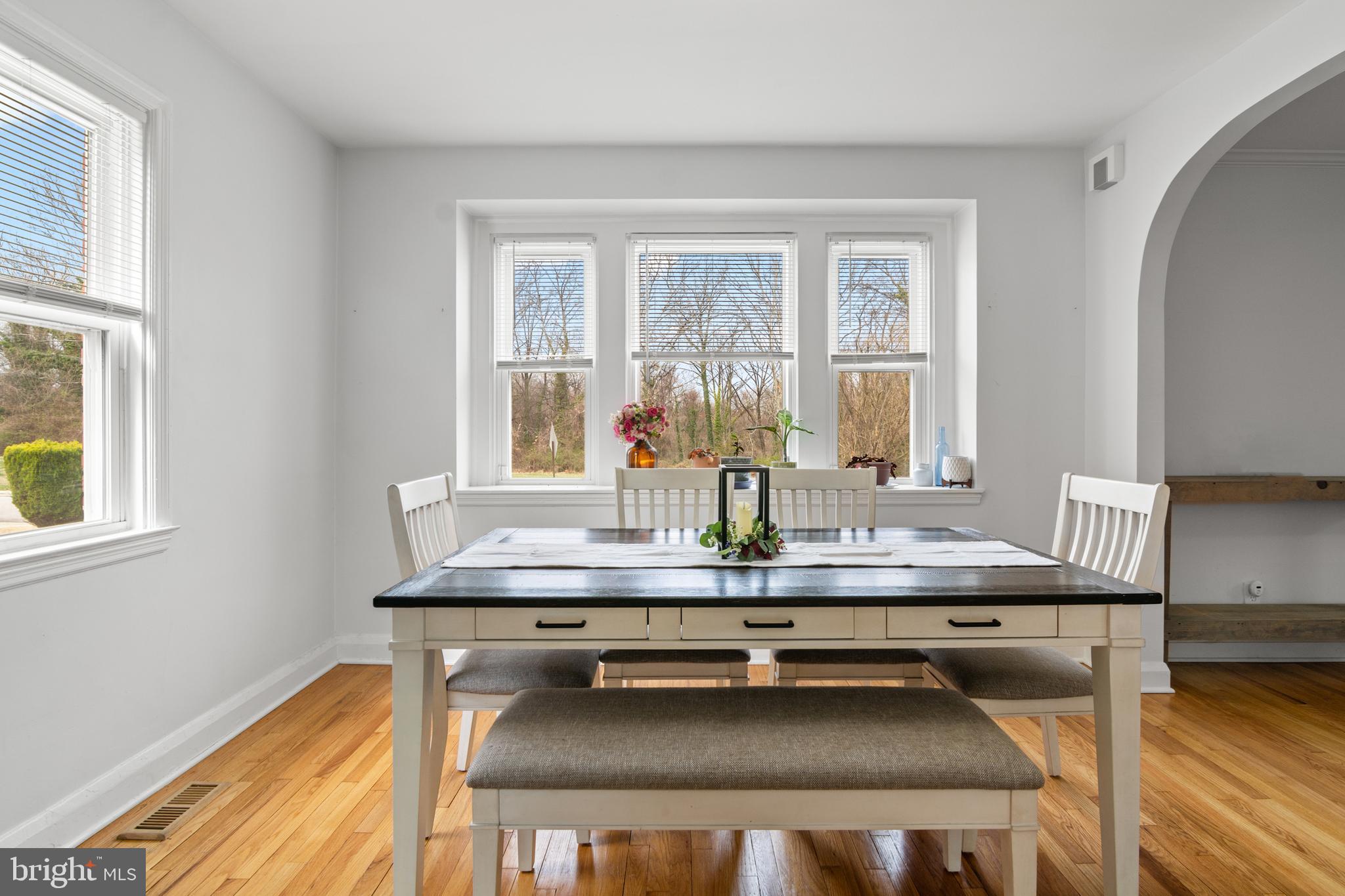 4823 Herring Run Drive Baltimore, MD 21214 - Photo 12 of 34 a dining room with table chairs and wooden floor