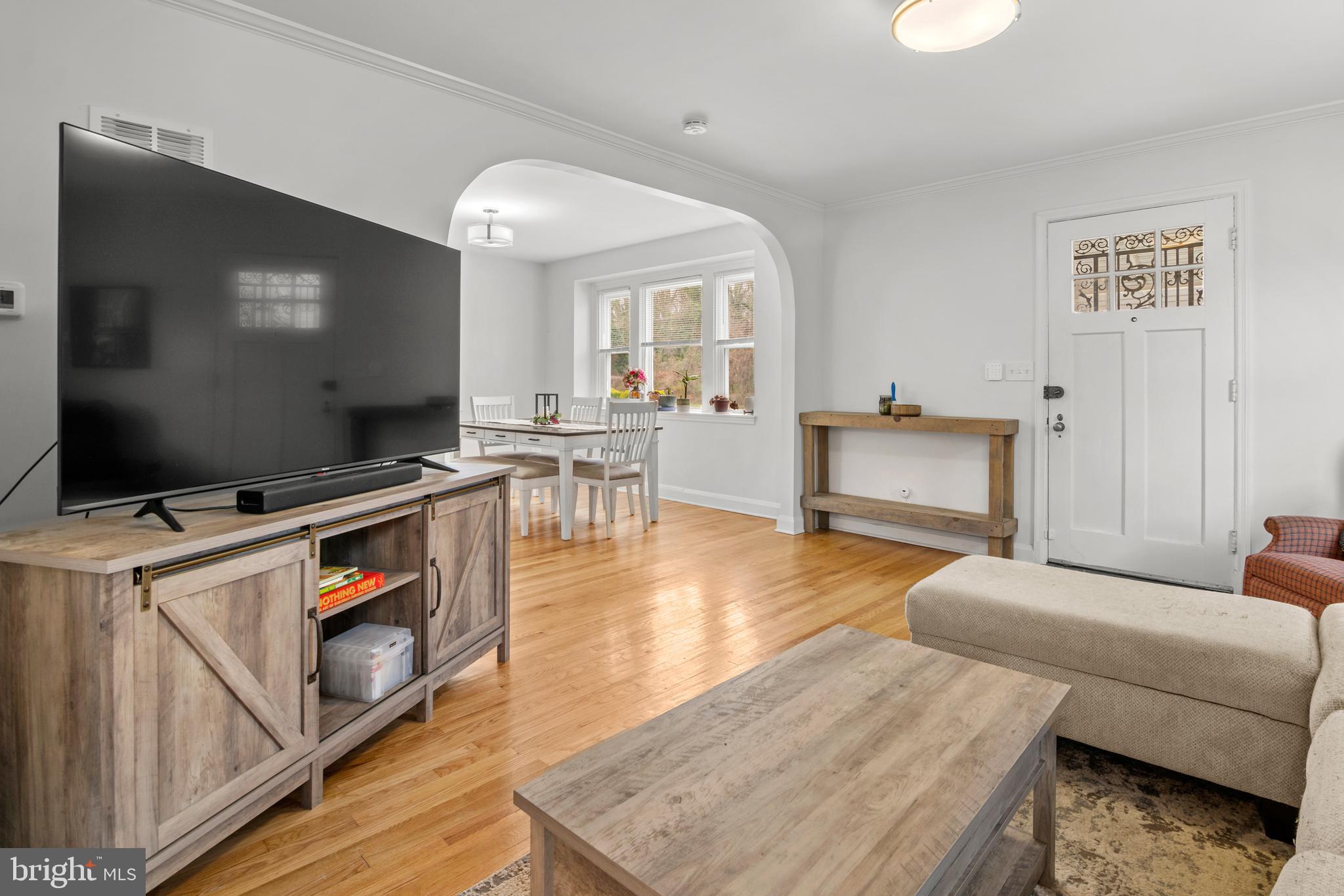 4823 Herring Run Drive Baltimore, MD 21214 - Photo 17 of 34 a living room with furniture and a flat screen tv