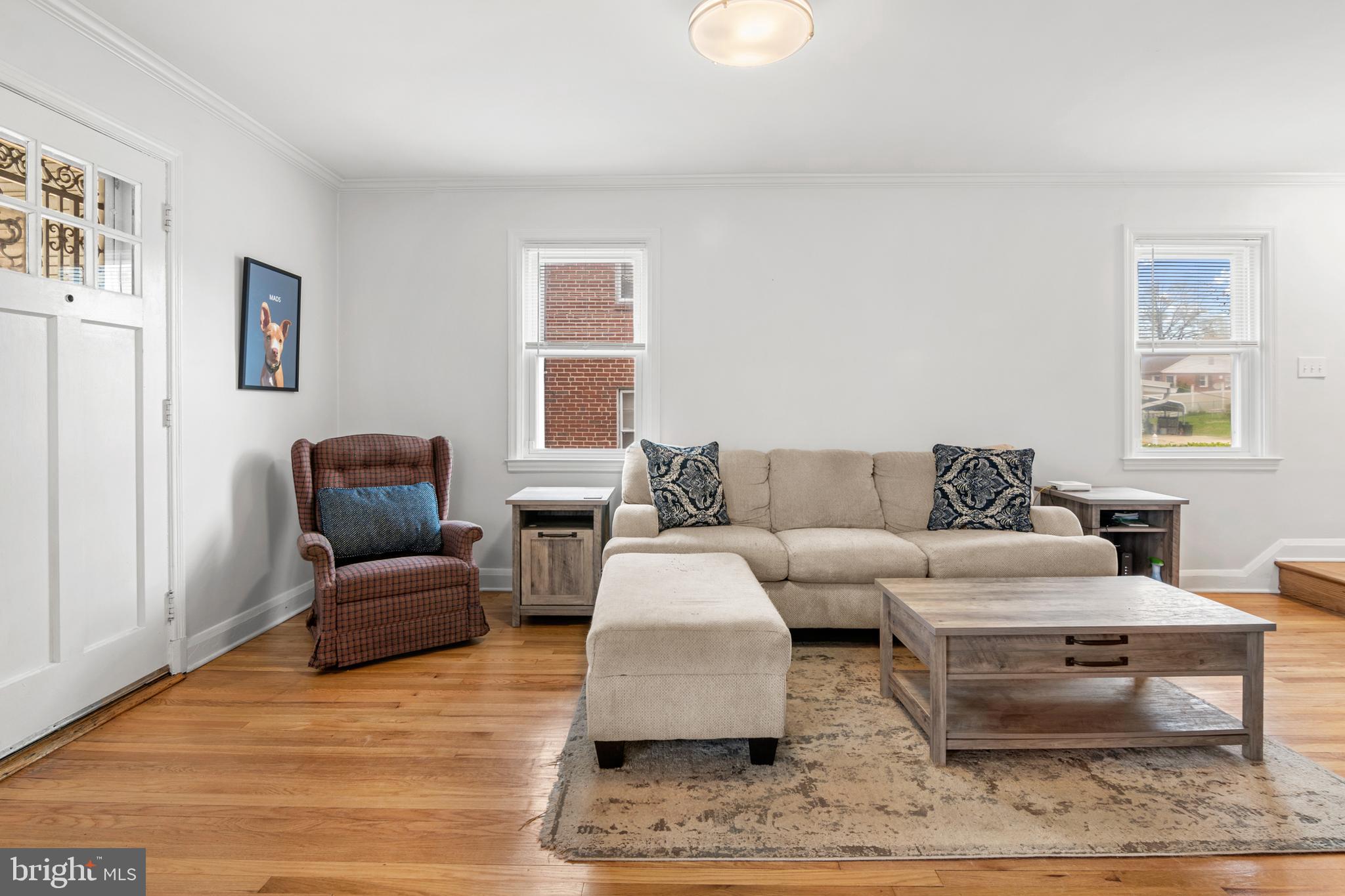 4823 Herring Run Drive Baltimore, MD 21214 - Photo 19 of 34 a living room with furniture and a couch