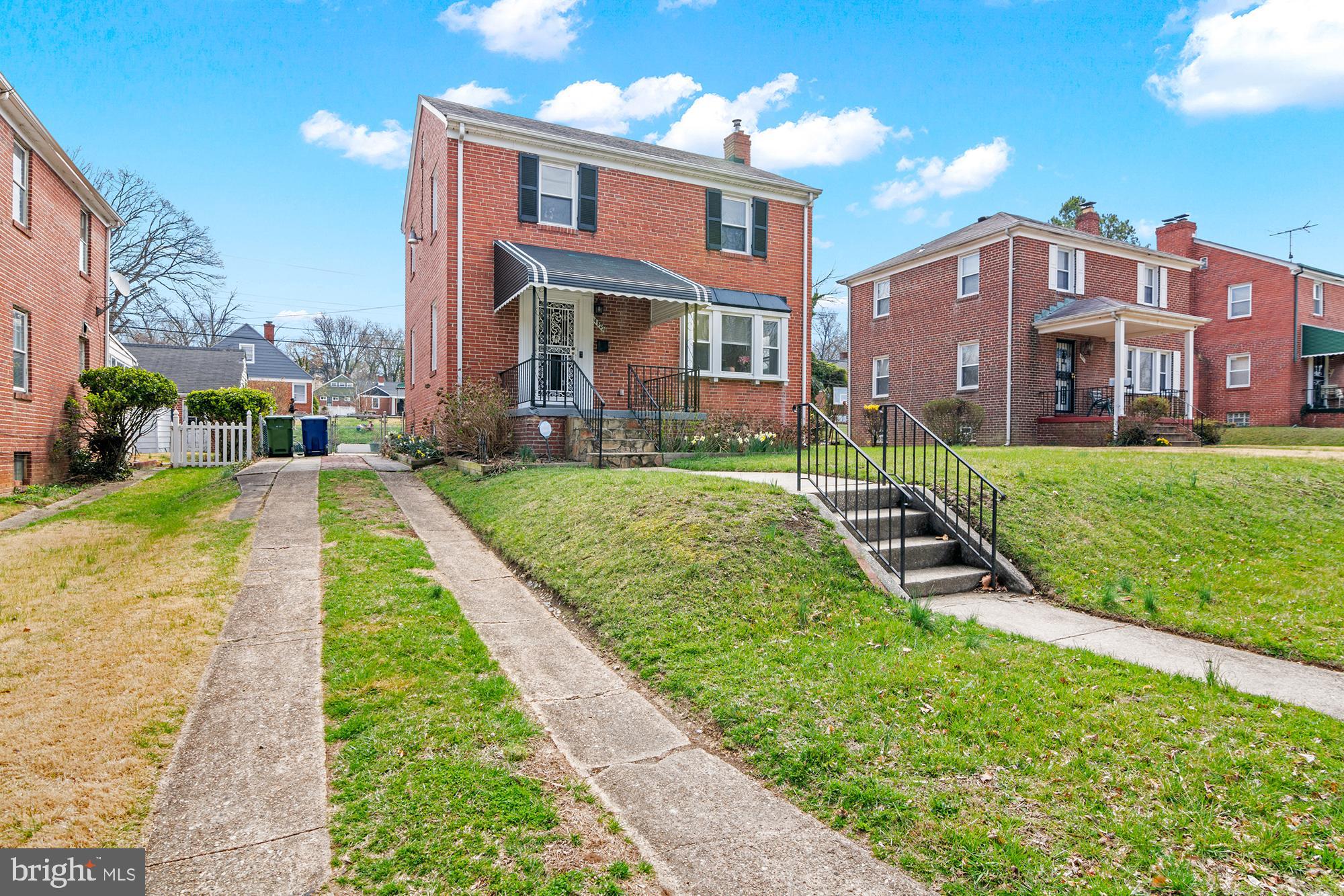 4823 Herring Run Drive Baltimore, MD 21214 - Photo 2 of 34 a view of a big yard in front of a brick building