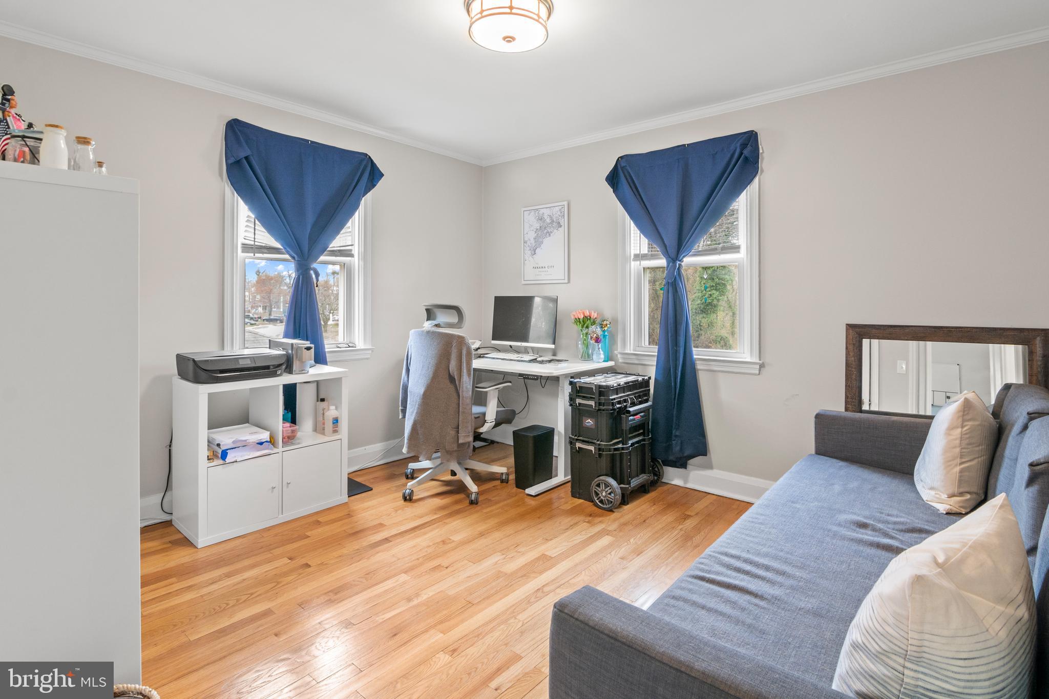 4823 Herring Run Drive Baltimore, MD 21214 - Photo 28 of 34 a bedroom with furniture and a window