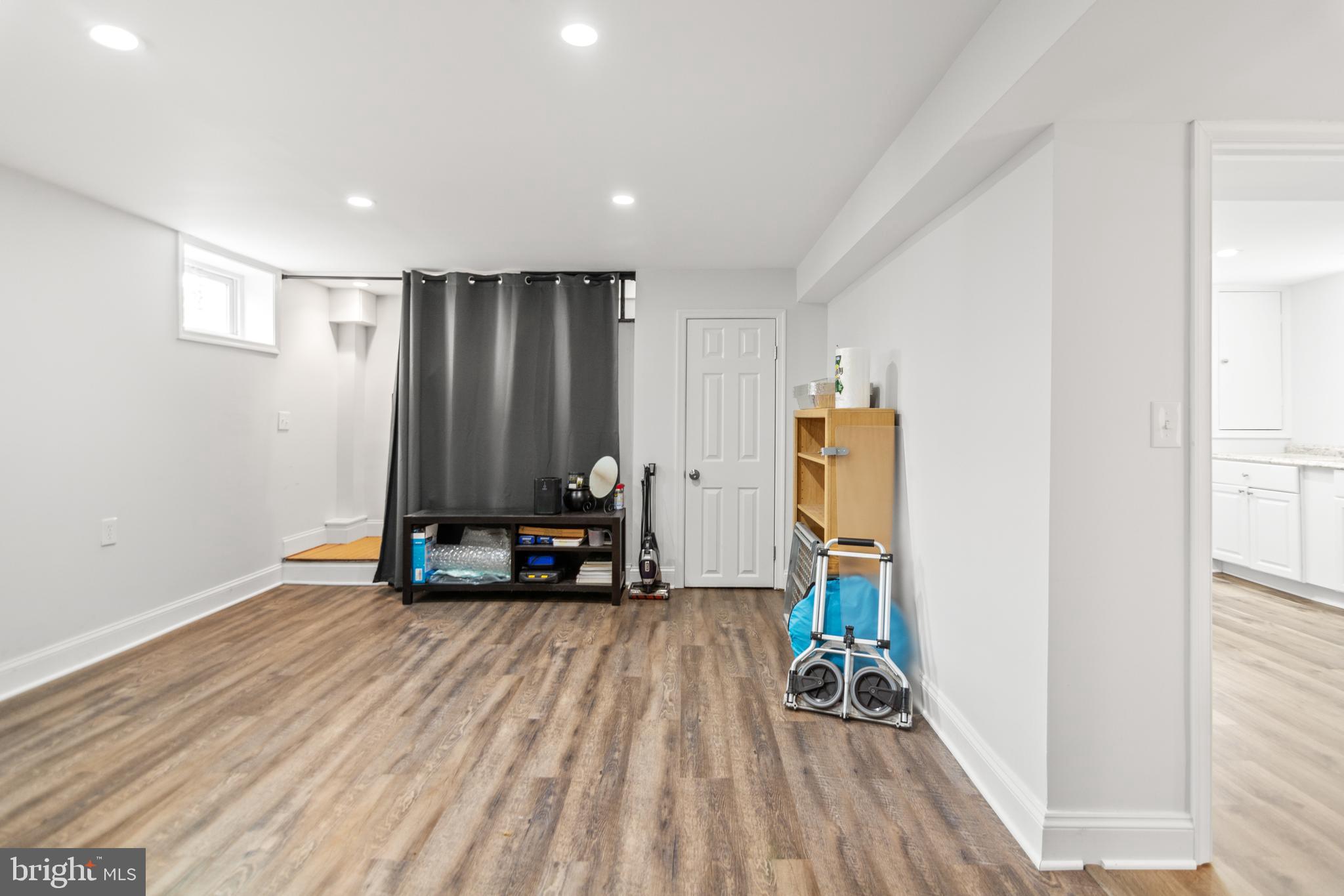 4823 Herring Run Drive Baltimore, MD 21214 - Photo 30 of 34 a view of room with gym equipment and wooden floor