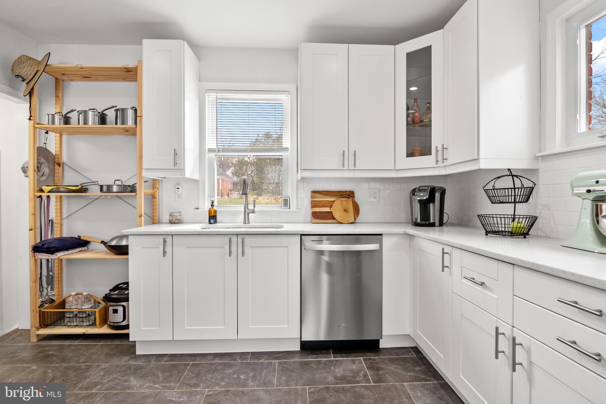 4823 Herring Run Drive Baltimore, MD 21214 - Photo 4 of 34 a kitchen with a sink cabinets and window