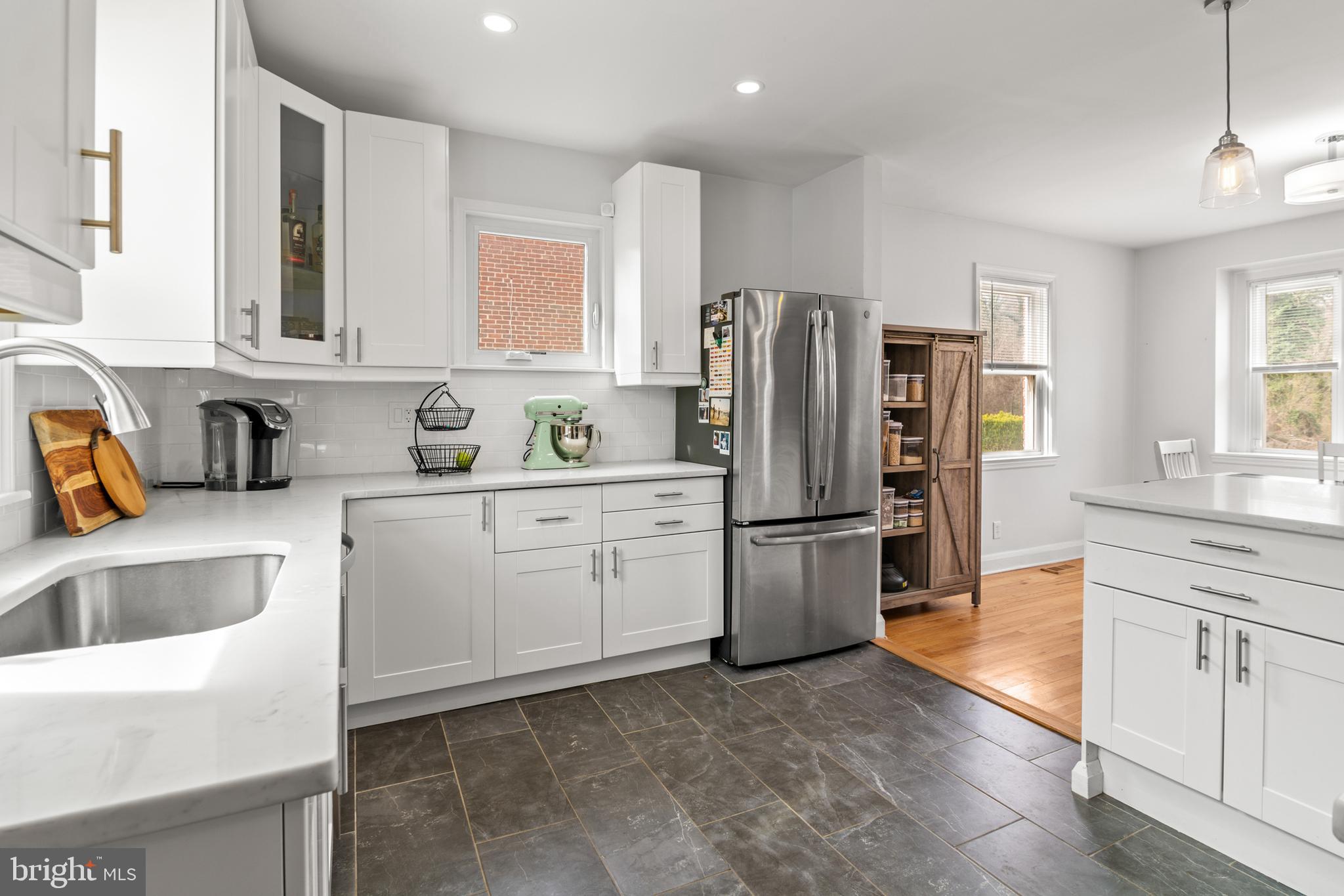 4823 Herring Run Drive Baltimore, MD 21214 - Photo 5 of 34 a kitchen with a refrigerator sink and cabinets