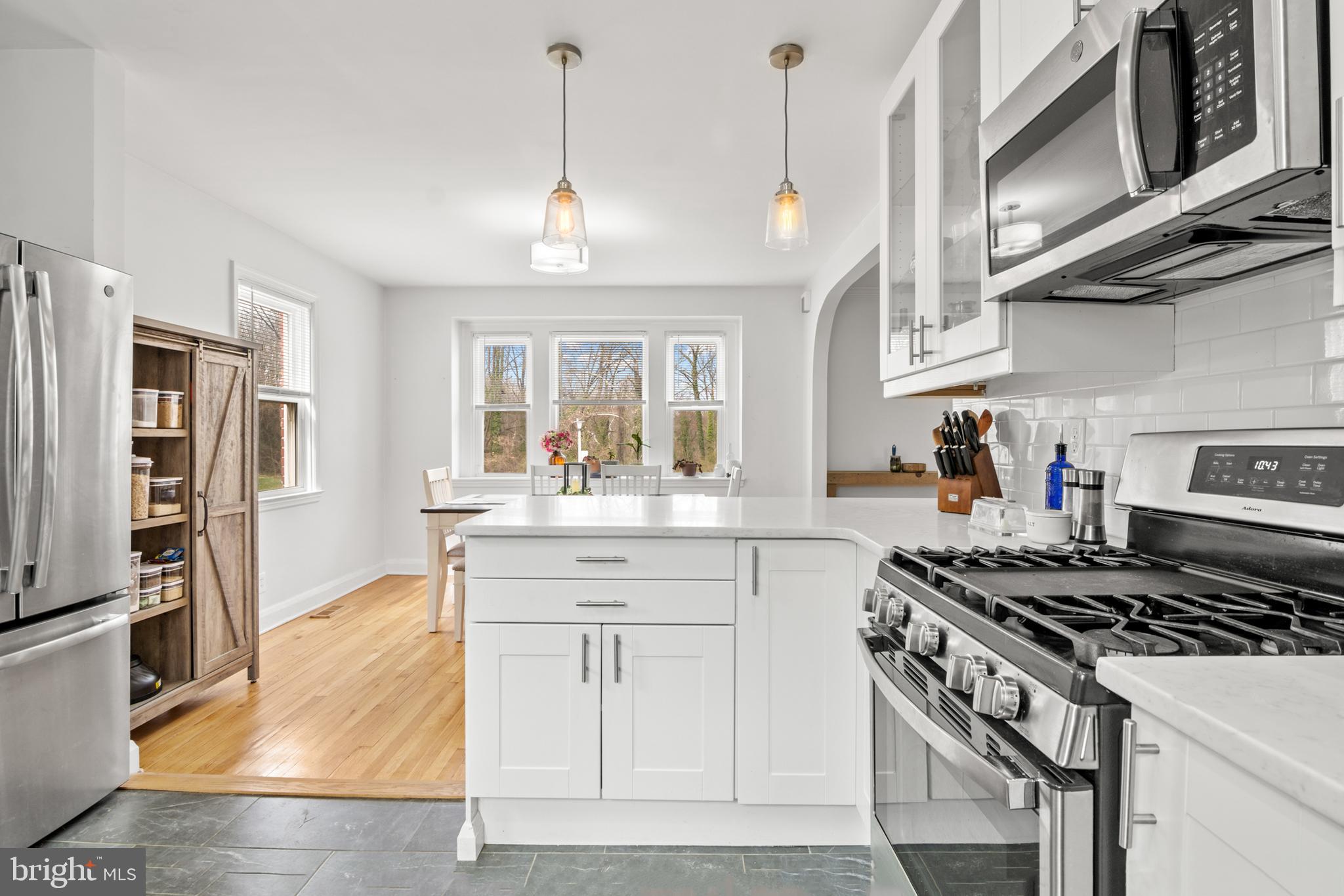4823 Herring Run Drive Baltimore, MD 21214 - Photo 9 of 34 a kitchen with stainless steel appliances granite countertop a stove and a sink