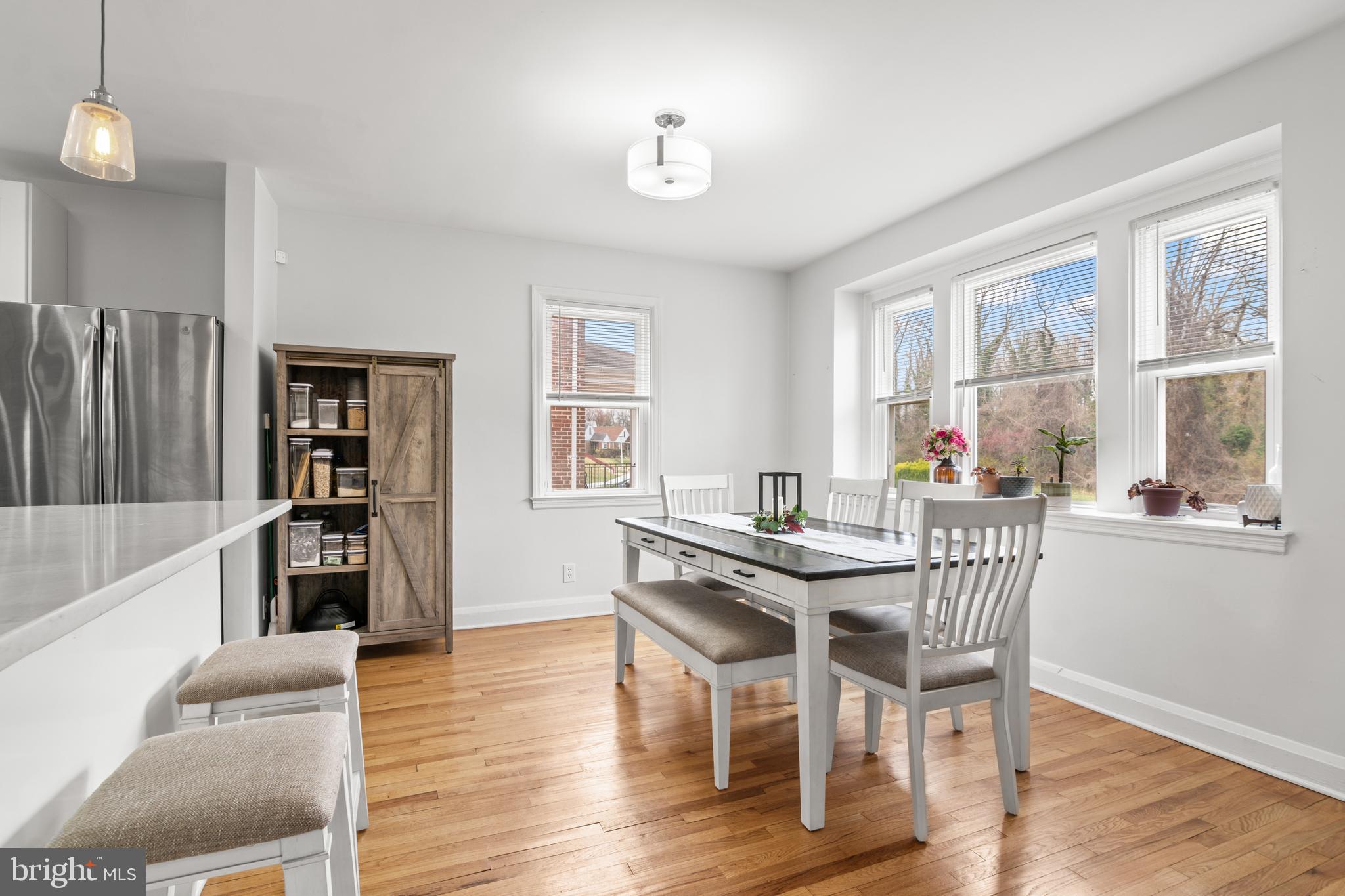 4823 Herring Run Drive Baltimore, MD 21214 - Photo 10 of 34 a view of a dining room with furniture window and wooden floor