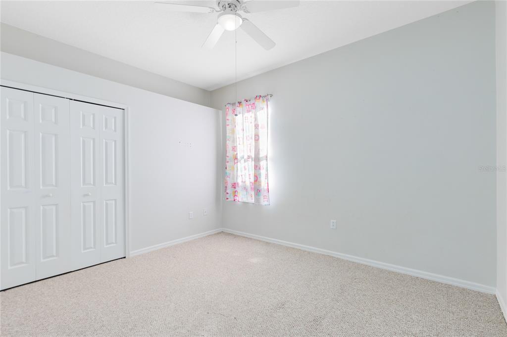 3510 Pawleys Loop South St. Cloud, FL 34769 - Photo 14 of 32 an empty room with a window