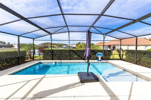 a view of a swimming pool with a porch