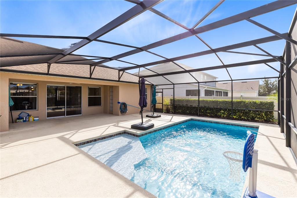 3510 Pawleys Loop South St. Cloud, FL 34769 - Photo 24 of 32 a view of a house with backyard and porch
