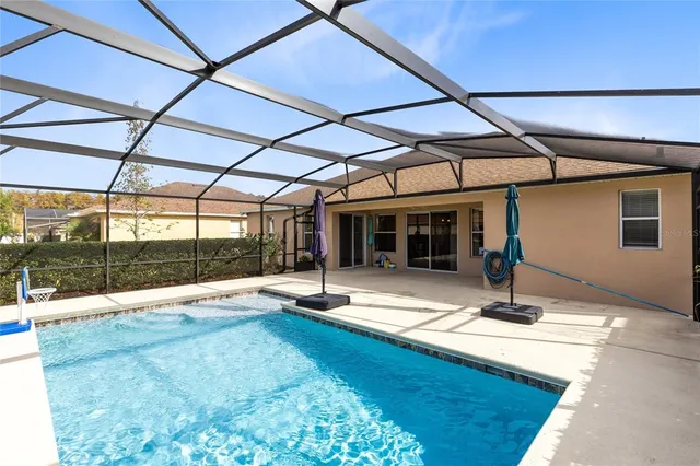 a view of swimming pool with seating space