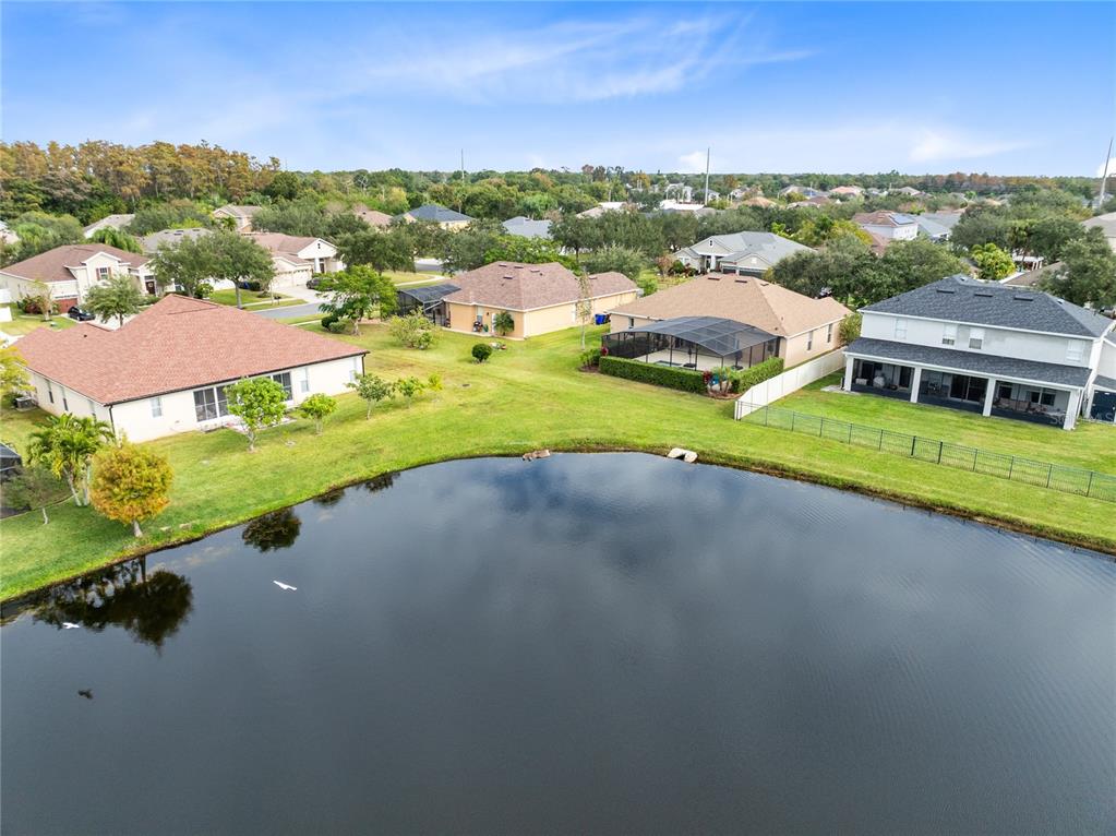 3510 Pawleys Loop South St. Cloud, FL 34769 - Photo 28 of 32 a view of a lake with houses