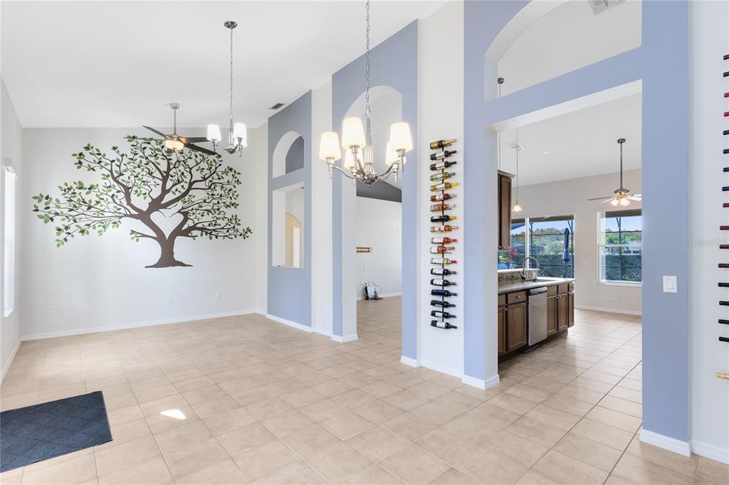 3510 Pawleys Loop South St. Cloud, FL 34769 - Photo 5 of 32 a view of a living room and chandelier fan